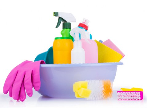 Professional cleaner tidying a modern Chelsea apartment