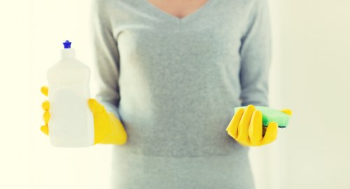Technician checking electrical carpet cleaning equipment safely